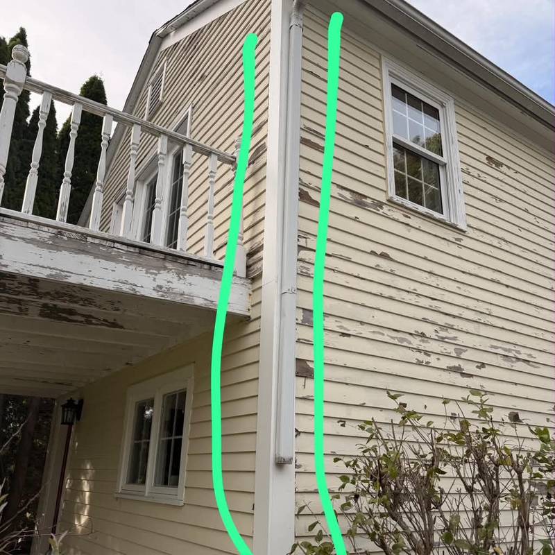 Peeling siding and a corner board with repair lines drawn in green.