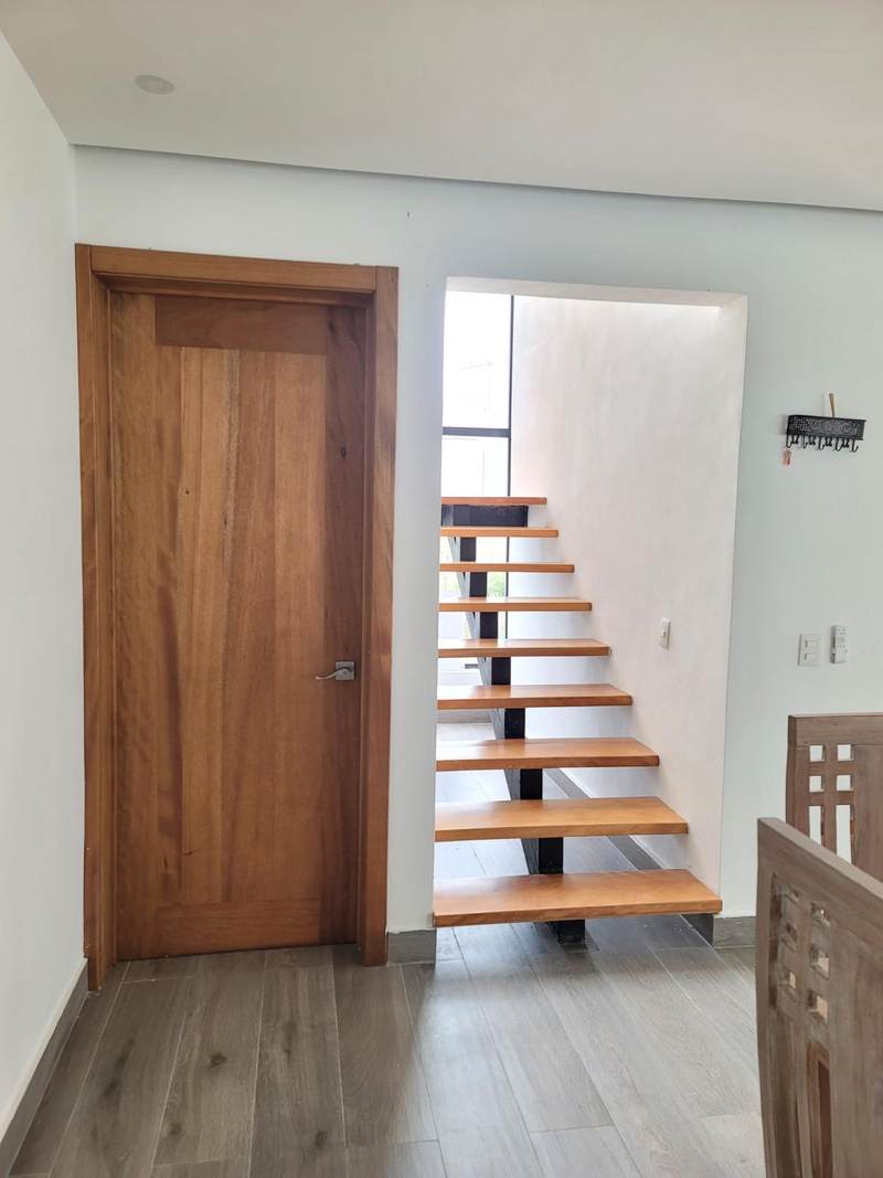 A finished interior stair and doorway photographed on site.